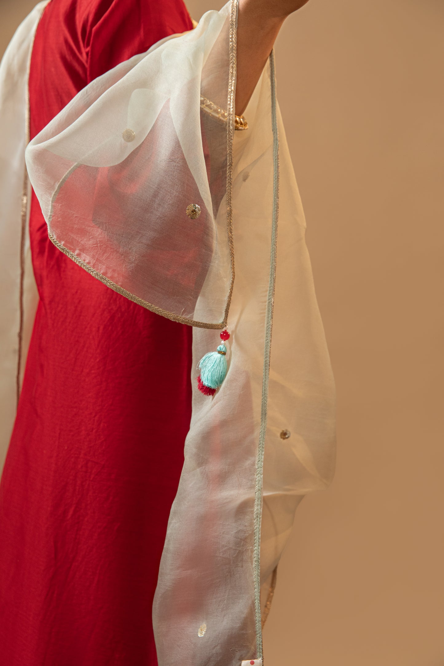 Red Hand-Embroidered Silk Kurta Set in Banarasi Silk chanderi with an organza dupatta with handmade tassels. Perfect for weddings and occasions.