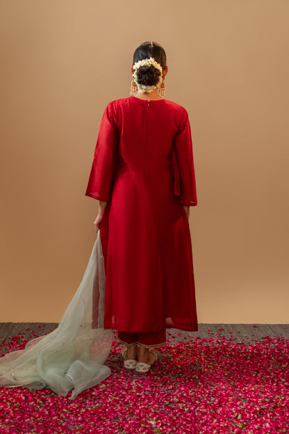 Red Hand-Embroidered Silk Kurta Set in Banarasi Silk chanderi with an organza dupatta with handmade tassels. Perfect for weddings and occasions.
