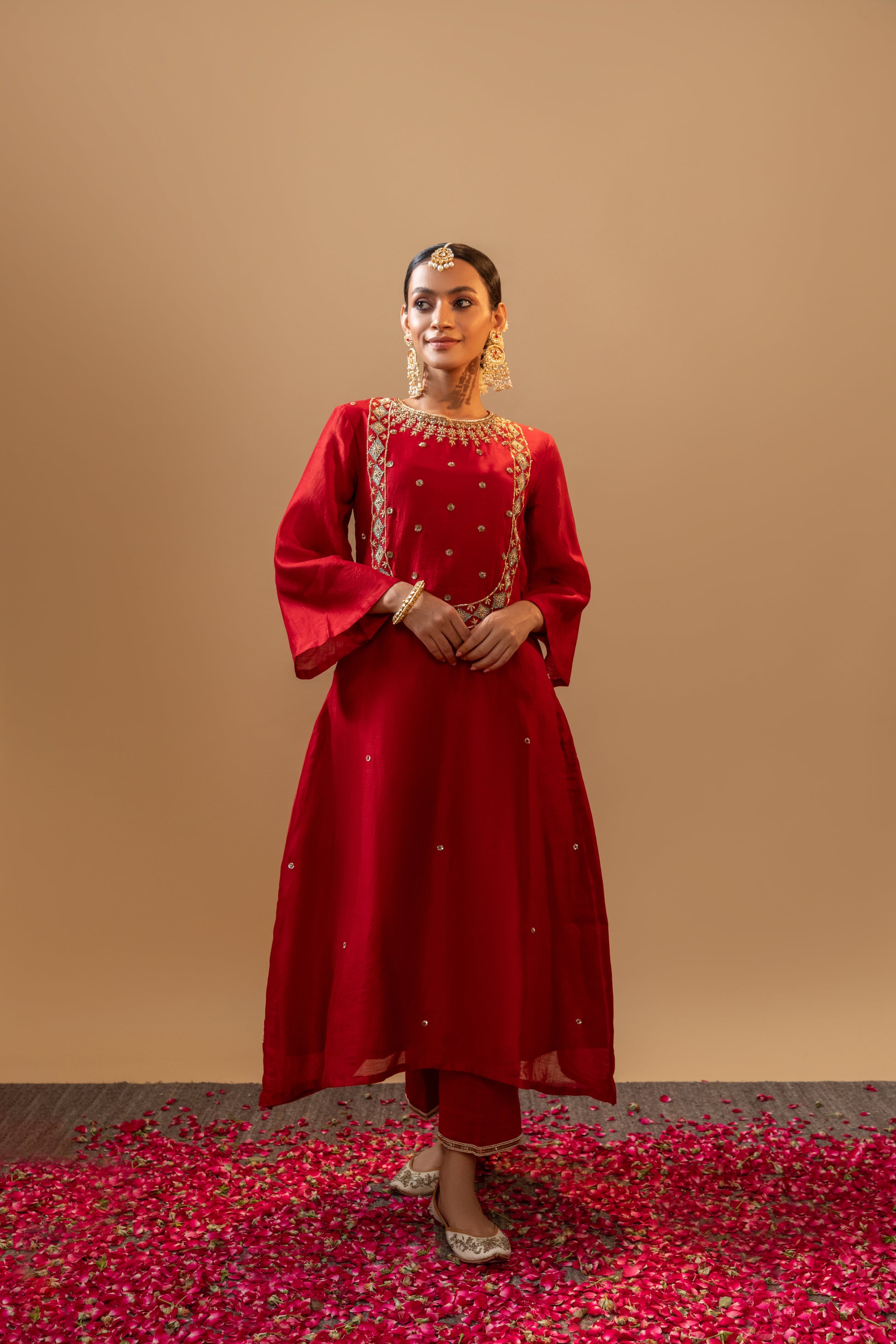Red Hand-Embroidered Silk Kurta Set in Banarasi Silk chanderi with an organza dupatta with handmade tassels. Perfect for weddings and occasions.